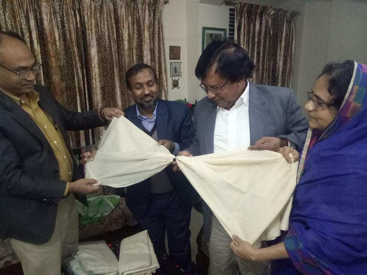 Committee members in Chittagong with re-invented Dhaka Muslin